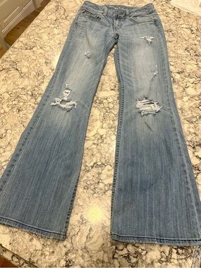 Distressed Light Blue Flare Jeans for Women